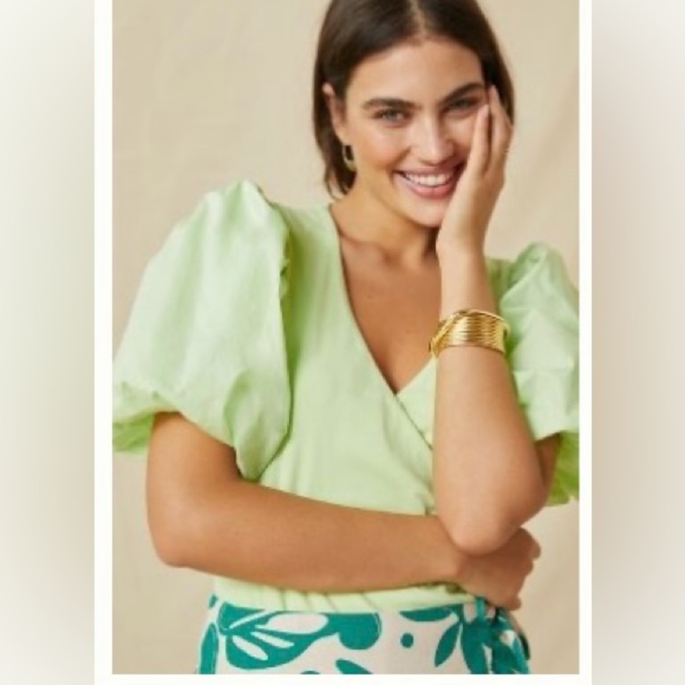 Lime colored puff sleeve wrap top from Anthropologie